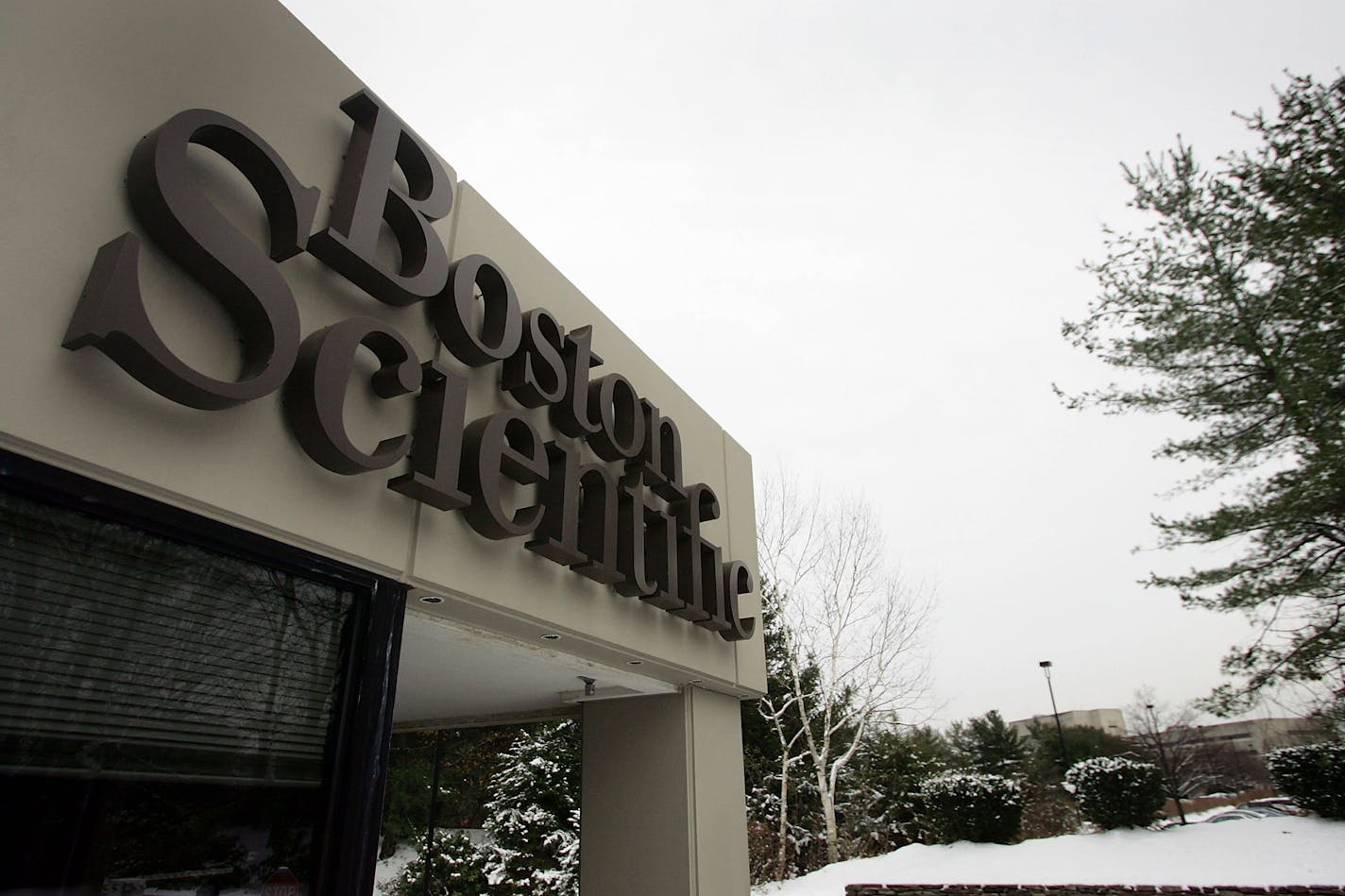 NATICK, MA - DECEMBER 05: A sign on the front gate of Boston Scientific Corp. headquarters is seen December 5, 2005 in Natick, Massachusetts. The company offered $25 billion for Guidant Corp., $3 billion more than what Johnson & Johnson agreed to pay last month.