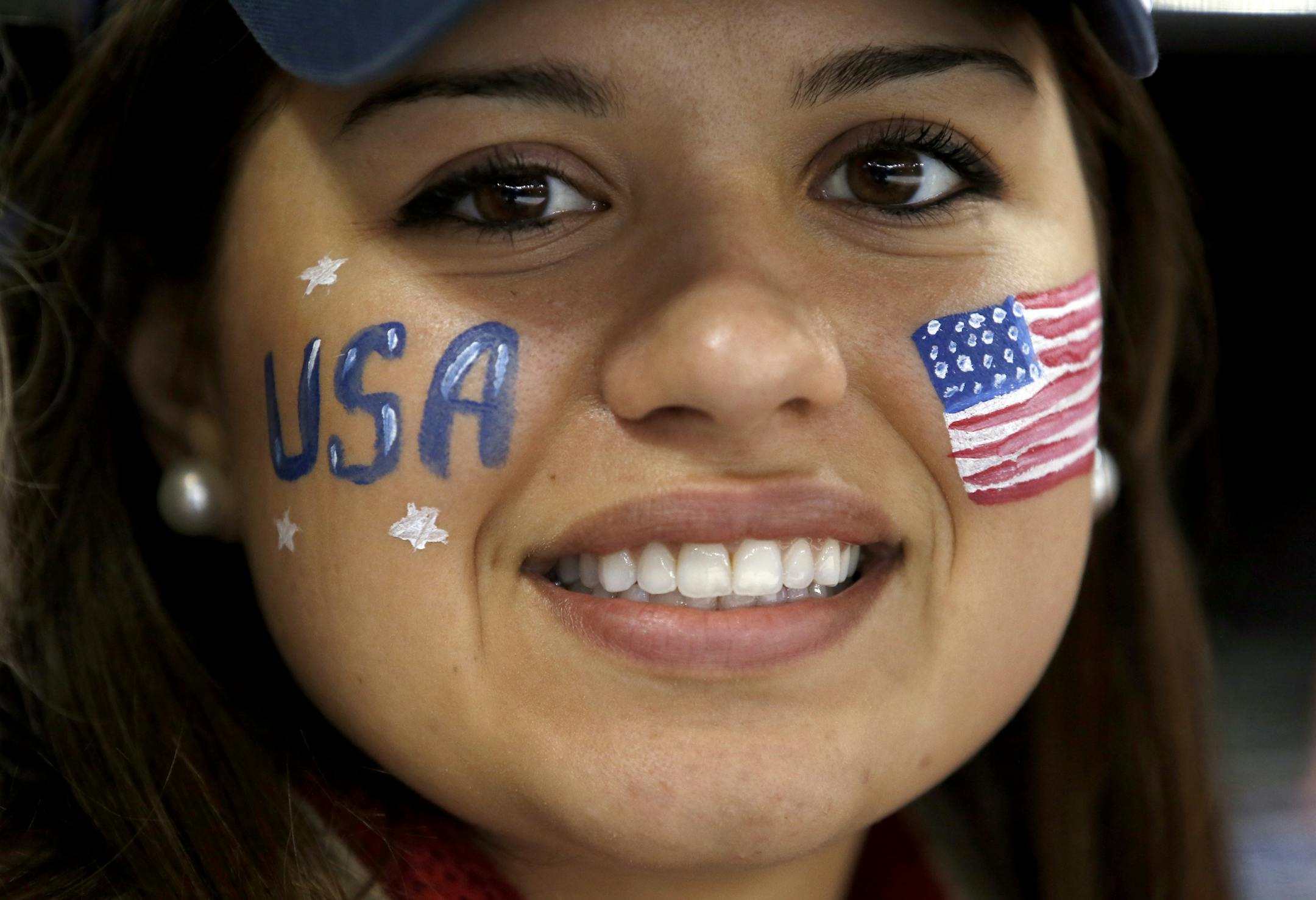 Samantha Pucci of Crow River, NY painted her face for Monday's semifinal game between the USA and Sweden in women's hockey. Samantha's sister Josephine Pucci plays for Team USA. USA beat Sweden by a fibnal score of 6-1.