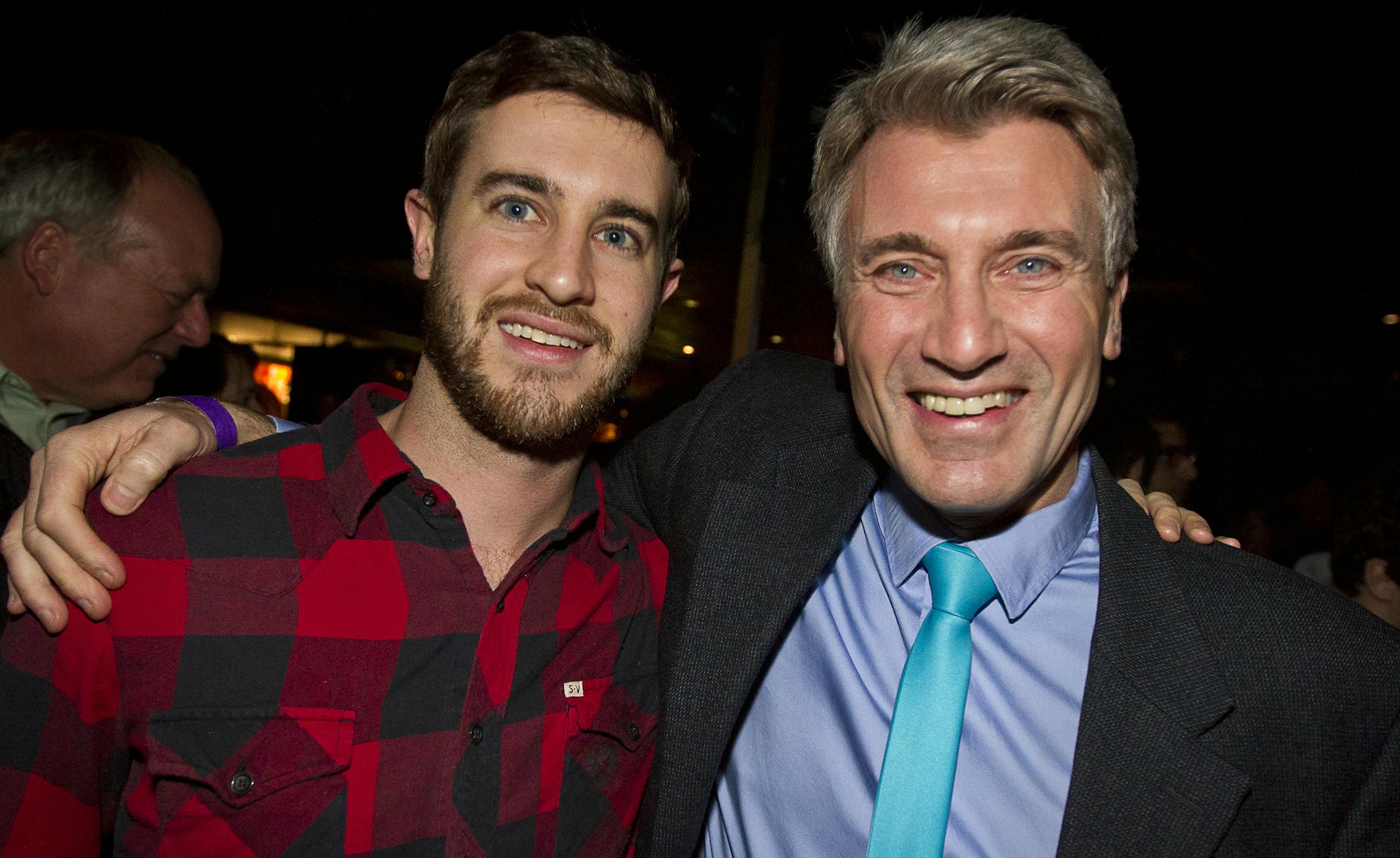 Minneapolis Mayor R.T. Rybak, right, poses for a photo with his son, Charlie during his "Unauguration Party" at First Avenue, Wednesday, December 18, 2013. His son flew in from Washington, D.C. to surprise the Mayor during the event.