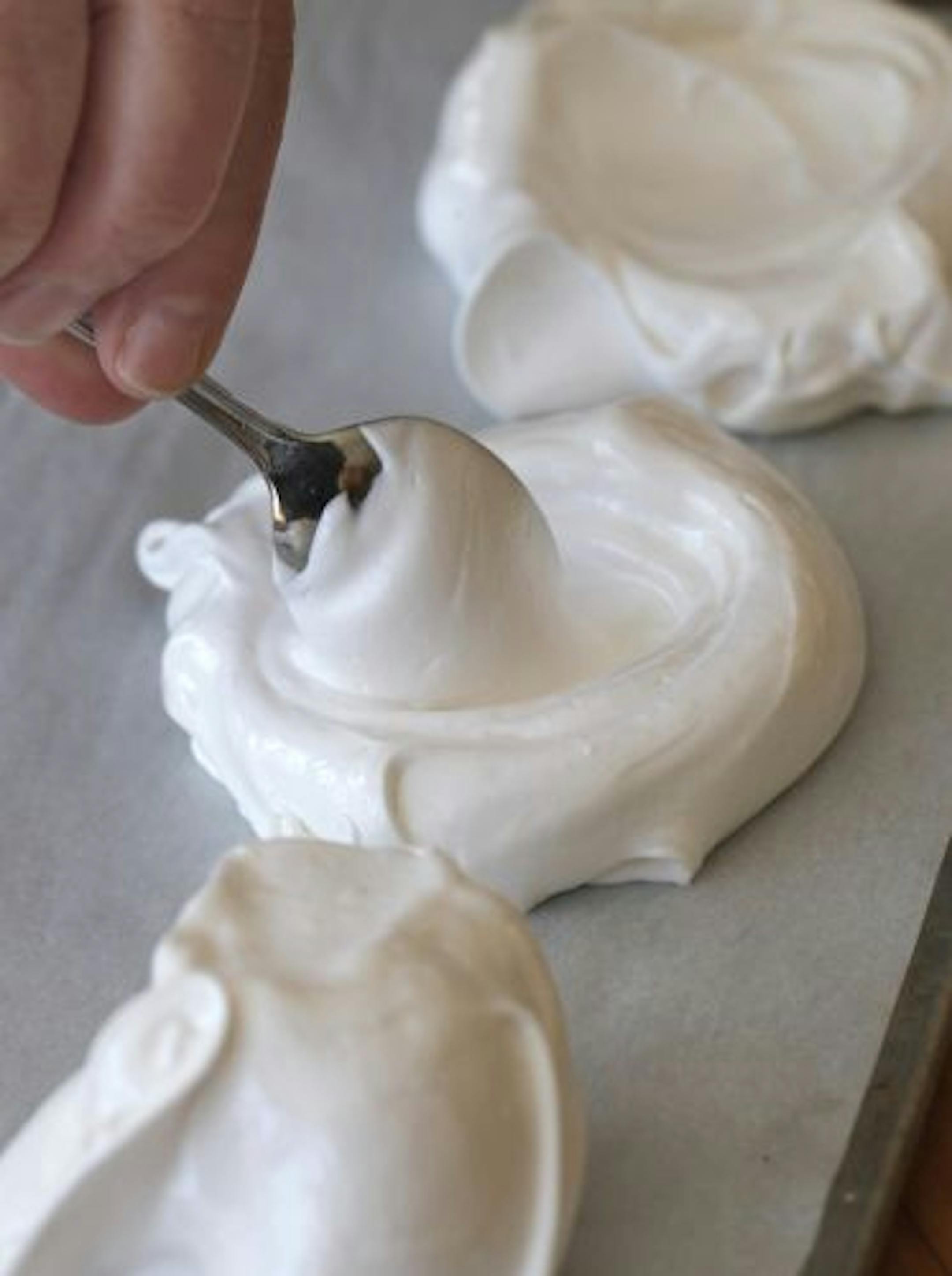 Meringue nests can be formed with a spoon or pastry bag.