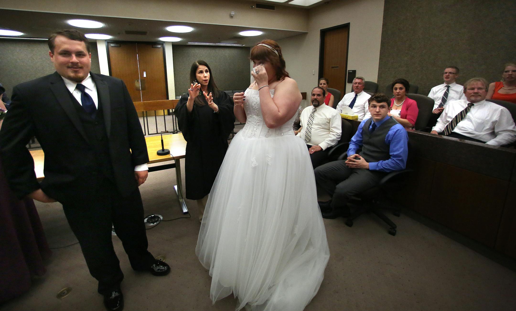 District Court Judge Tamara Garcia talked with Eric Seybert and Ashley (Aldrich) Seybert, Richfield, after she performed their wedding ceremony in her courtroom Friday afternoon. Judge Garcia, earned $5,500 in wedding fees over the past two years. Her total is typical of most Hennepin County judges that agree to do weddings. ] JIM GEHRZ ‚Ä¢ jgehrz@startribune.com / Minneapolis, MN / June 27, 2014 / 4:30 PM / BACKGROUND INFORMATION: It's a part of the job district judges cherish-