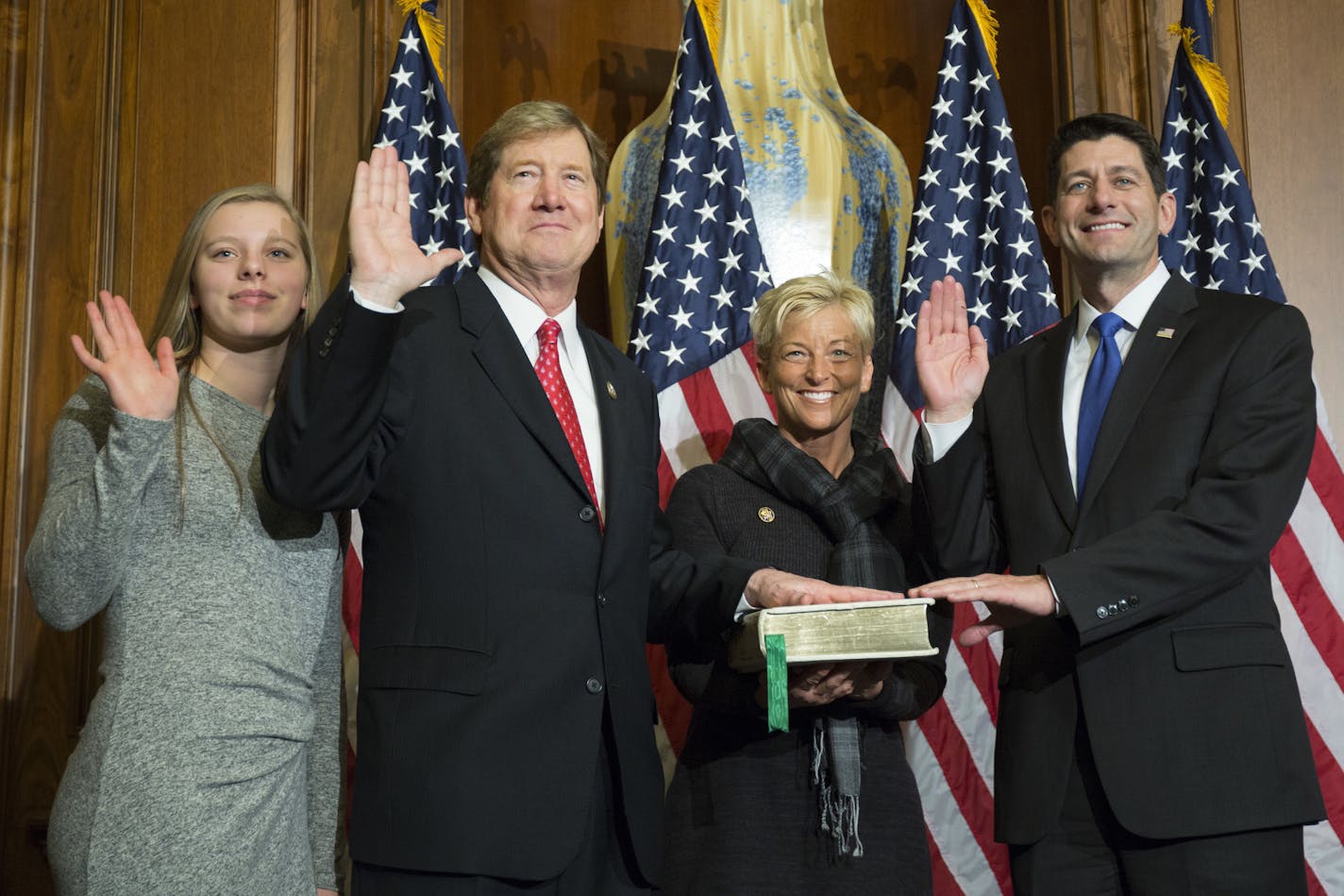 House Speaker Paul Ryan of Wis. administers the House oath of office to Rep. Jason Lewis, R-Minn., during a mock swearing in ceremony on Capitol Hill in Washington, Tuesday, Jan. 3, 2017. (AP Photo/Zach Gibson) ORG XMIT: DCEV146