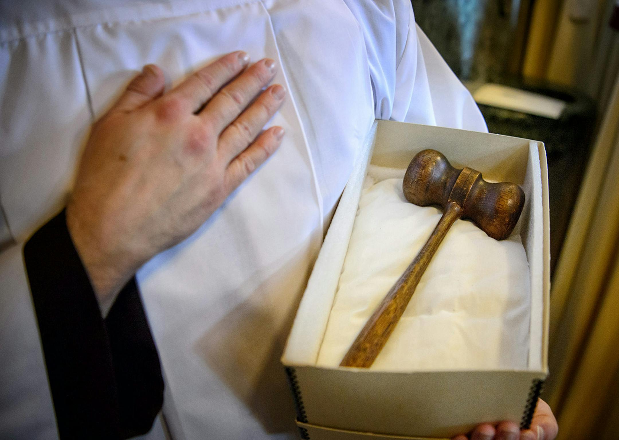 The mallet made from wood from the archdiocese's first cathedral was used as Archbishop Bernard Hebda used it to symbolically knock on the doors of the cathedral.