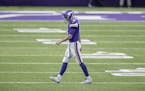 Minnesota Vikings quarterback Kirk Cousins made his way off the field after throwing a interception during the second quarter.