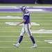 Minnesota Vikings quarterback Kirk Cousins made his way off the field after throwing a interception during the second quarter.