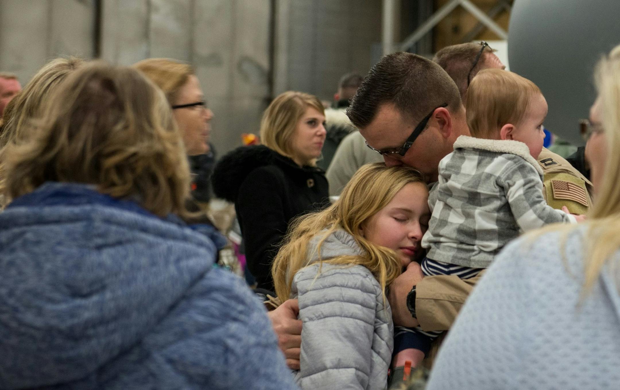 Capt. Garrett Weston squeezed in one final goodbye with his family before shipping out Sunday for his overseas assignment.