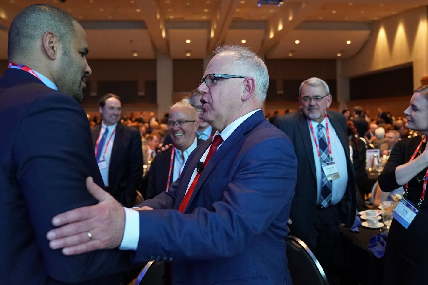 Gov. Tim Walz spoke with Tony Sanneh of the Sanneh Foundation during the Minnesota Chamber of Commerce's annual policy kickoff event Wednesday.