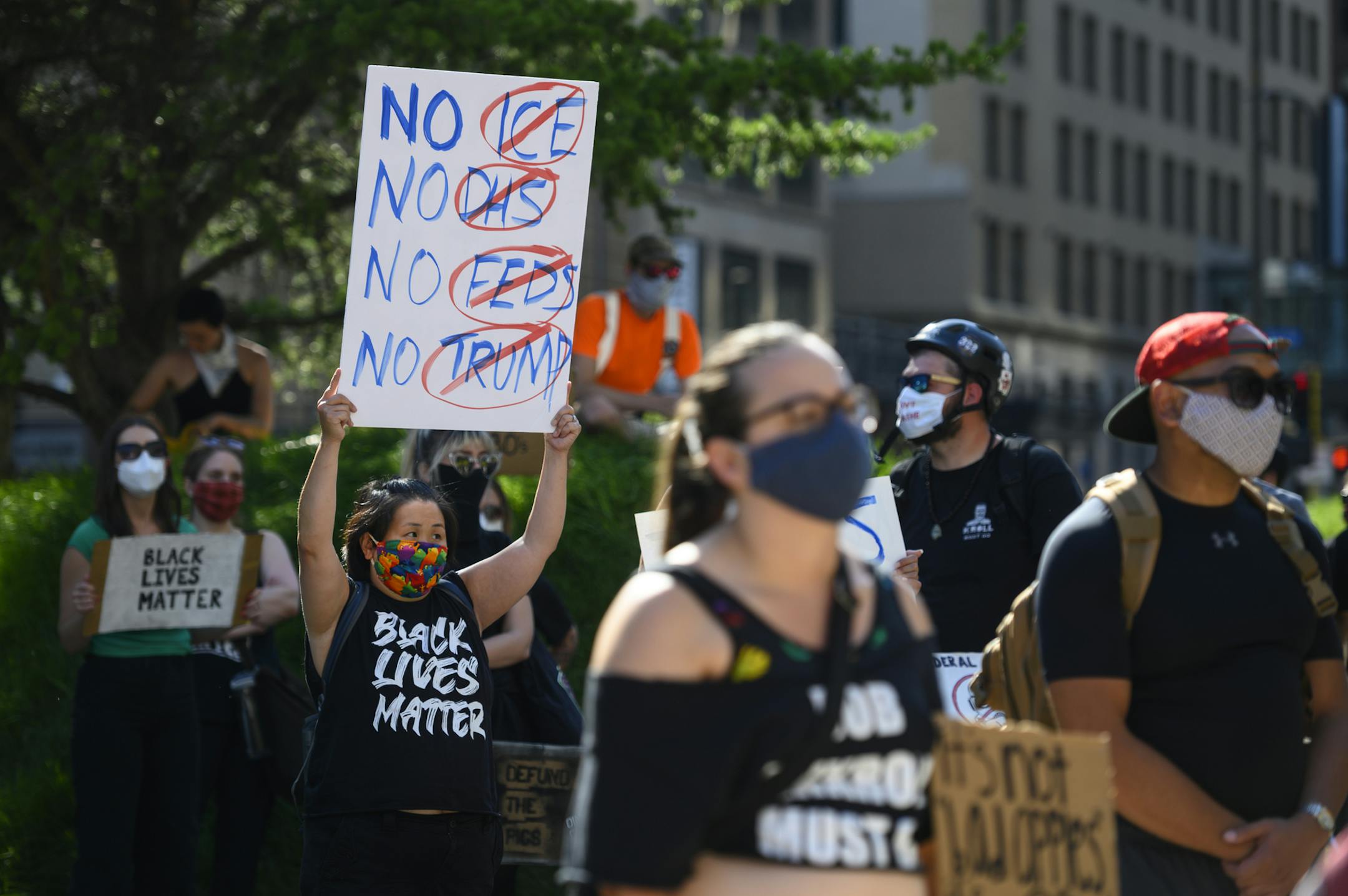 Kaia Hirt, of Minnetonka, held anti-Trump and federal law enforcement sign outside the federal courthouse in downtown Minneapolis Thursday. "We've under attack by the federal government," Hirt said. "This has to stop." ] aaron.lavinsky@startribune.com A rally, "Portland to Mpls: Protest Trump's Goons Attacking Our Movement," was held outside the federal courthouse on Thursday, July 23, 2020 in Minneapolis, Minn.