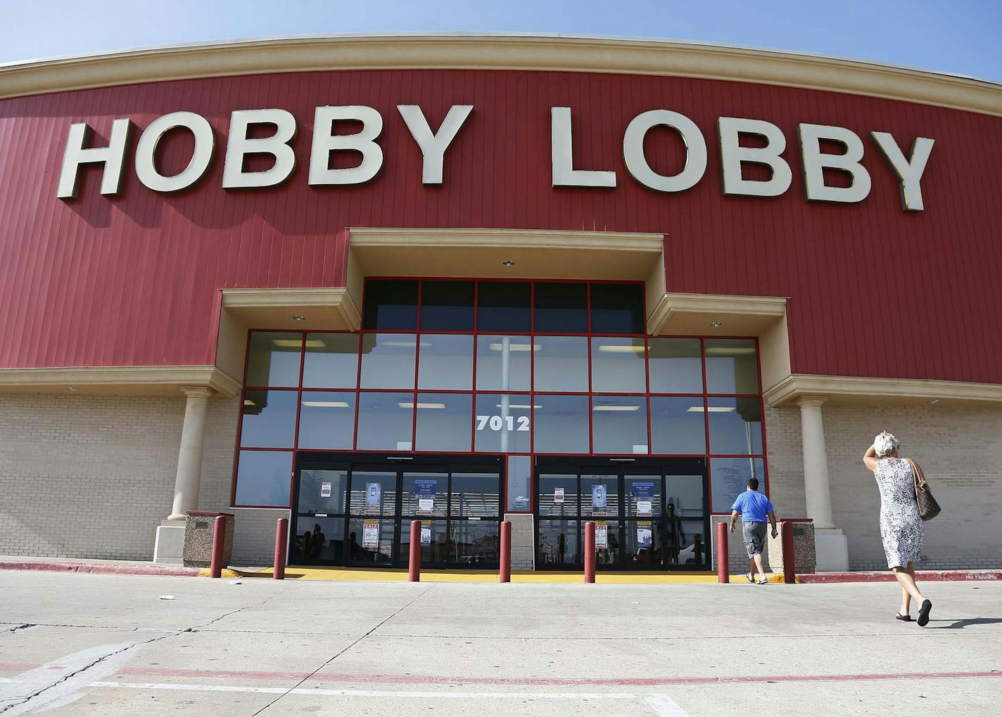 FILE - This June 30, 2014, file photo shows customers walking into a Hobby Lobby store in Oklahoma City. There may be more to that "we the people" notion than you thought.These are boom times for the concept of "corporate personhood." Corporations are people? Mitt Romney got mocked during the 2012 presidential campaign for the very idea. But it turns out the principle has been lurking in U.S. law for more than a century, and the Supreme Court, in a 5-4 ruling, gave it more oomph this week when i