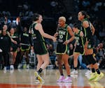 The Lynx's Bridget Carleton (6) and Courtney Williams (10) scored 23 and 11 points, respectively, against the Liberty in the WNBA Commissioner's Cup o