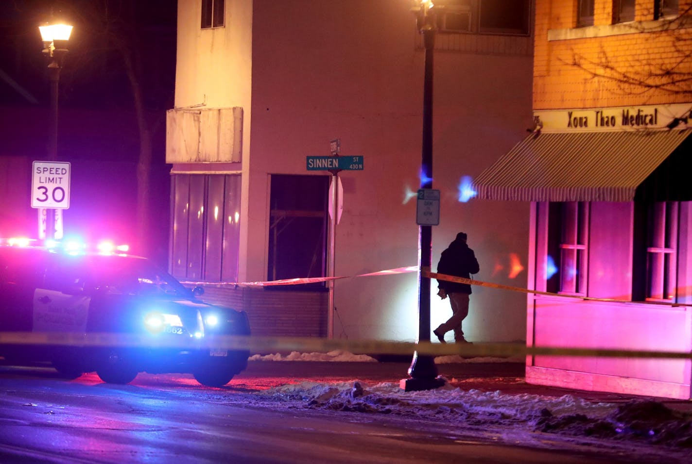 A police investigator at the scene of a police involved shooting that left one adult male dead and seen near East Seventh and Sinnen Streets Wednesday, March 15, 2017, in St. Paul, MN.