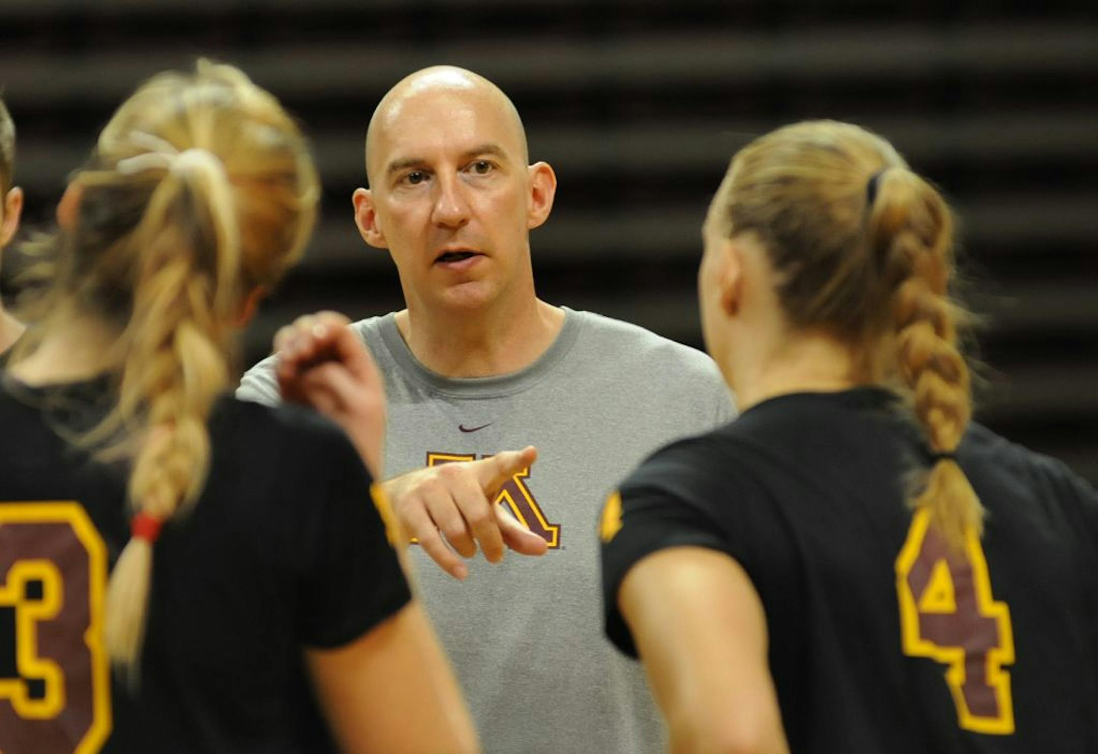 The new Gophers volleyball coach Hugh McCutcheon joined the women's volleyball team Thursday August 30, 2012 after his break following the Olympics. He was talking about hitting the ball with number 3 Dana Knudsen and number 4 Brianna Haugen, during practice at the U of M Sports Pavilion.