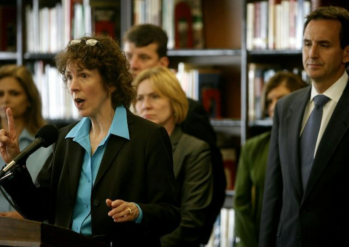 Dr. Sanne Magnan, Minnesota Health Department commissioner, discussed the H1N1 flu virus in Minnesota during a news conference with Gov. Tim Pawlenty, right, at Rocori Middle School.