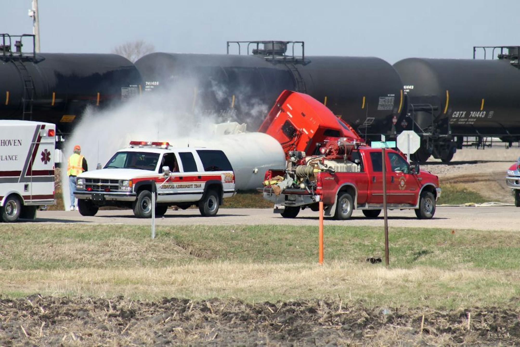 Emergency crews respond to a collision between a Burlington Northern Santa Fe train and a semi carrying anhydrous ammonia Tuesday in Murdock, Minn.