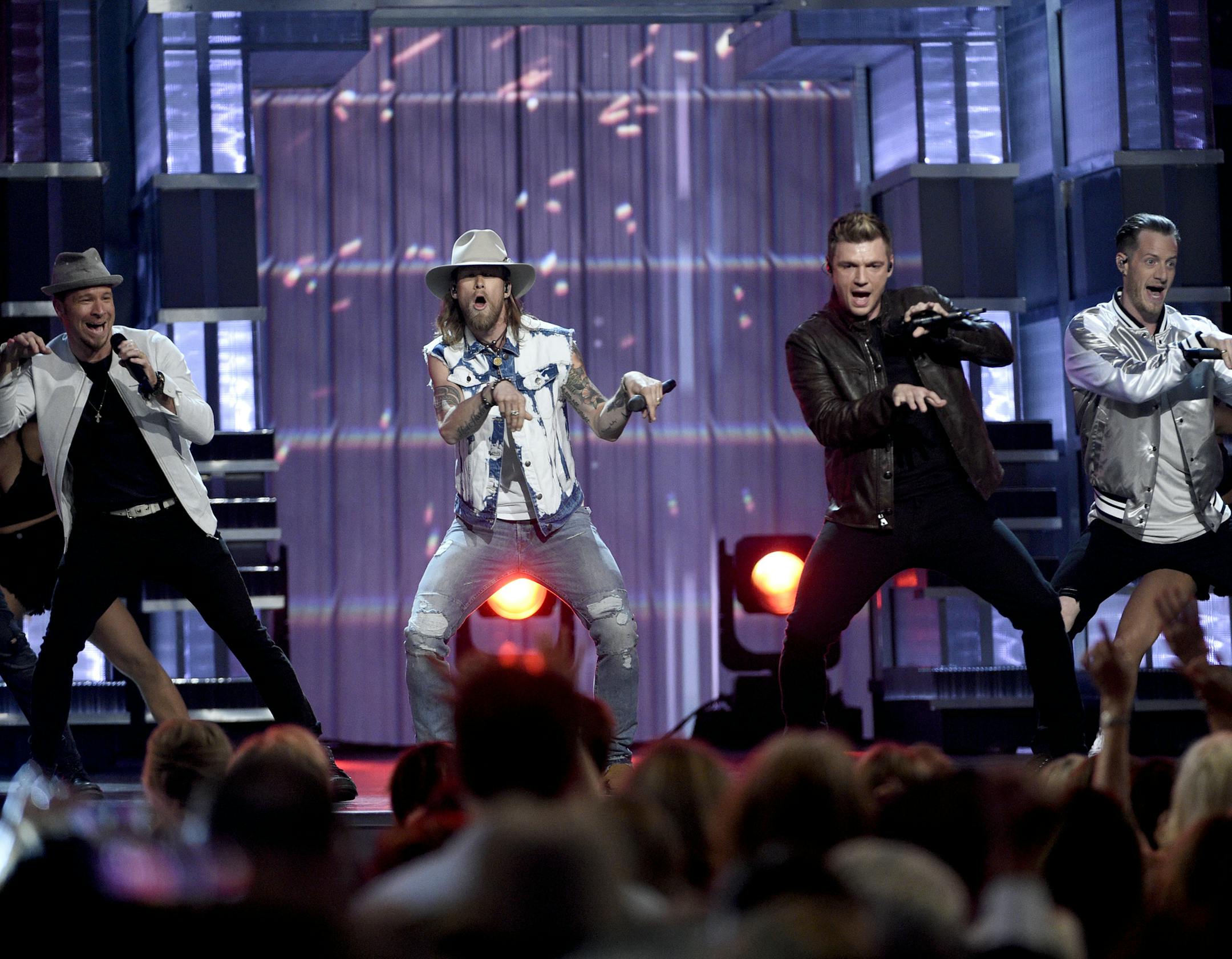 Brian Littrell, left, and Nick Carter, second from right, of Backstreet Boys, and Brian Kelley, second left, and Tyler Hubbard, right, of Florida Georgia Line, perform at the 52nd annual Academy of Country Music Awards at the T-Mobile Arena on Sunday, April 2, 2017, in Las Vegas. (Photo by Chris Pizzello/Invision/AP)