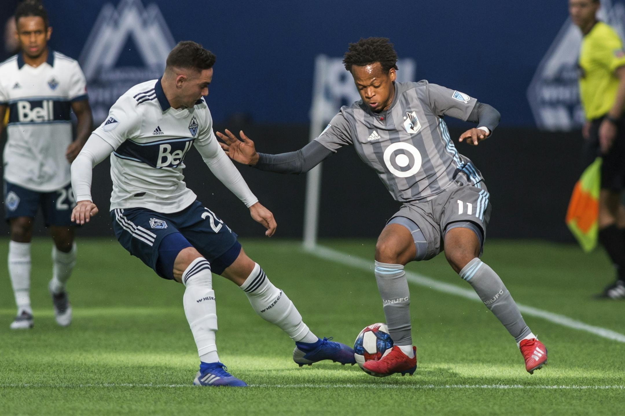Vancouver Whitecaps' Jake Nerwinski (28) plays the ball against Minnesota United's Romario Ibarra (11) during the first half of an MLS soccer match Saturday, March 2, 2019, in Vancouver, British Columbia.