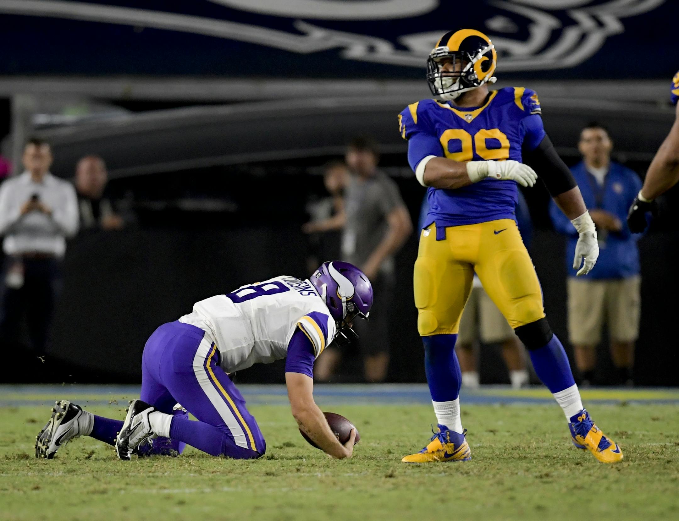 Los Angeles Rams defensive tackle Aaron Donald, right, celebrates after sacking Minnesota Vikings quarterback Kirk Cousins during the second half in an NFL football game Thursday, Sept. 27, 2018, in Los Angeles.