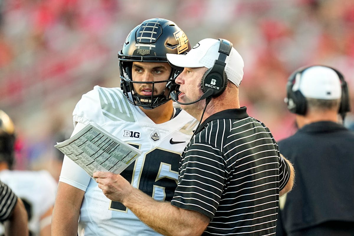 Purdue coach Jeff Brohm spoke to quarterback Aidan O’Connell during the team’s loss at Wisconsin on Oct. 22.
