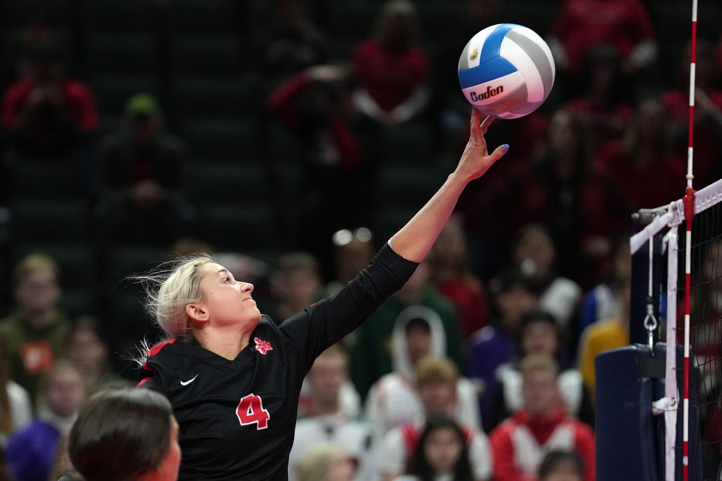 Mayer Lutheran outside hitter Gabrielle Wachholz (4) tips the ball over the net in the second set of a Class 1A semifinal volleyball game between Mabel-Canton and Mayer Lutheran Friday, Nov. 11, 2022 at the Xcel Energy Center in St. Paul, Minn. ] ANTHONY SOUFFLE • anthony.souffle@startribune.com