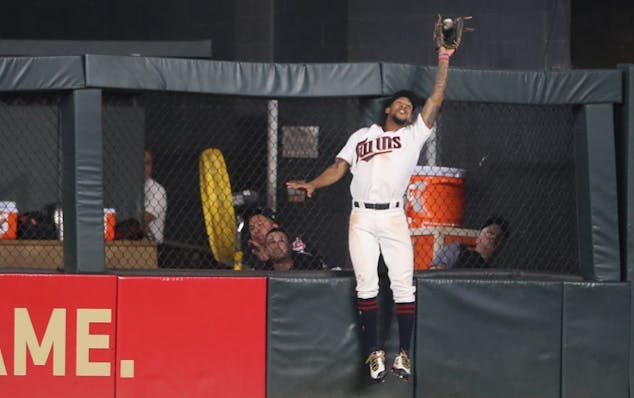 Byron Buxton robs Cleveland Indians designated hitter Edwin Encarnacion of a home run last season.