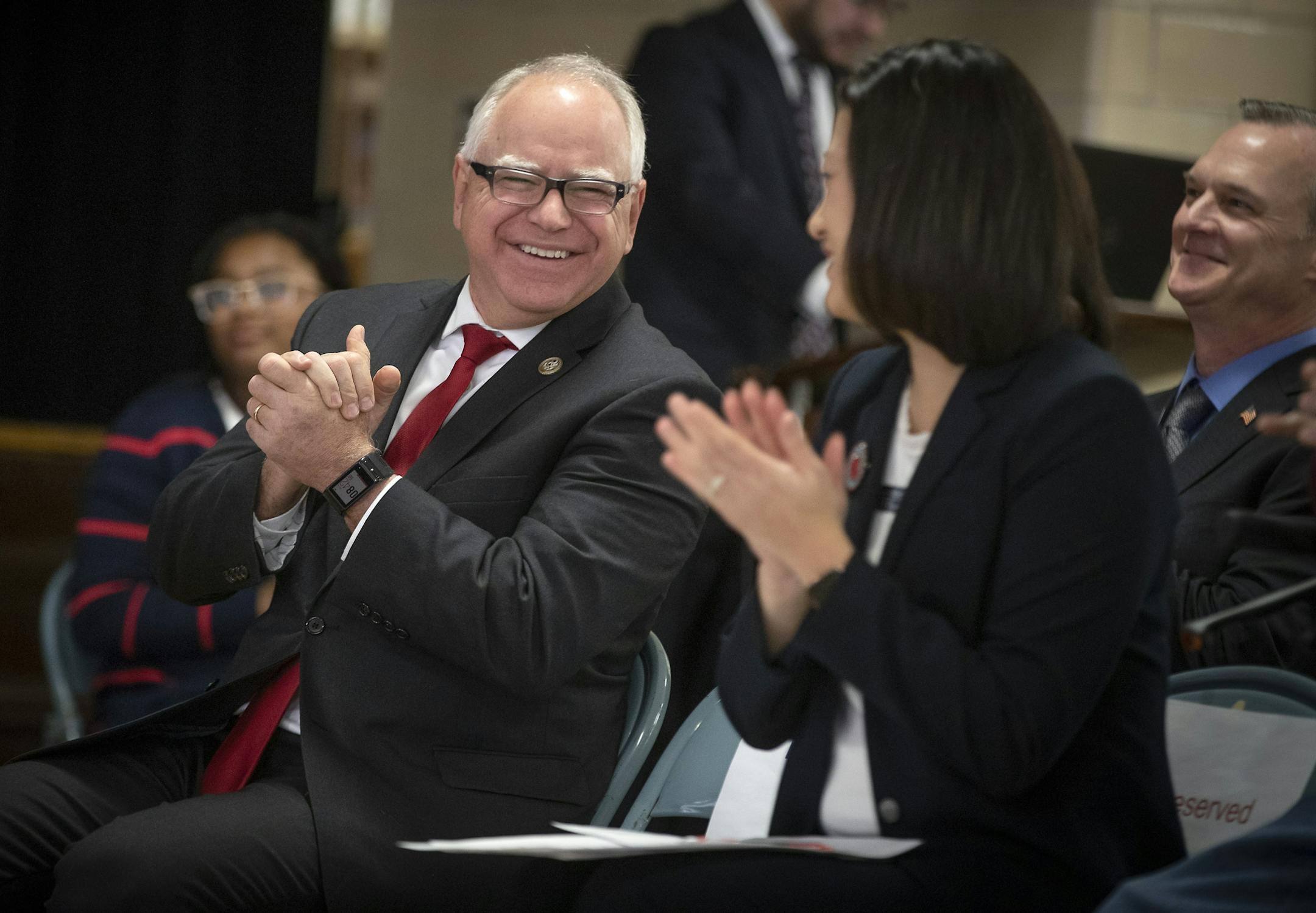 Governor-elect Tim Walz, left, and Principal Amy Winter, recognized veterans and students at Richfield STEM Elementary Veteran's Day event on Nov. 19.