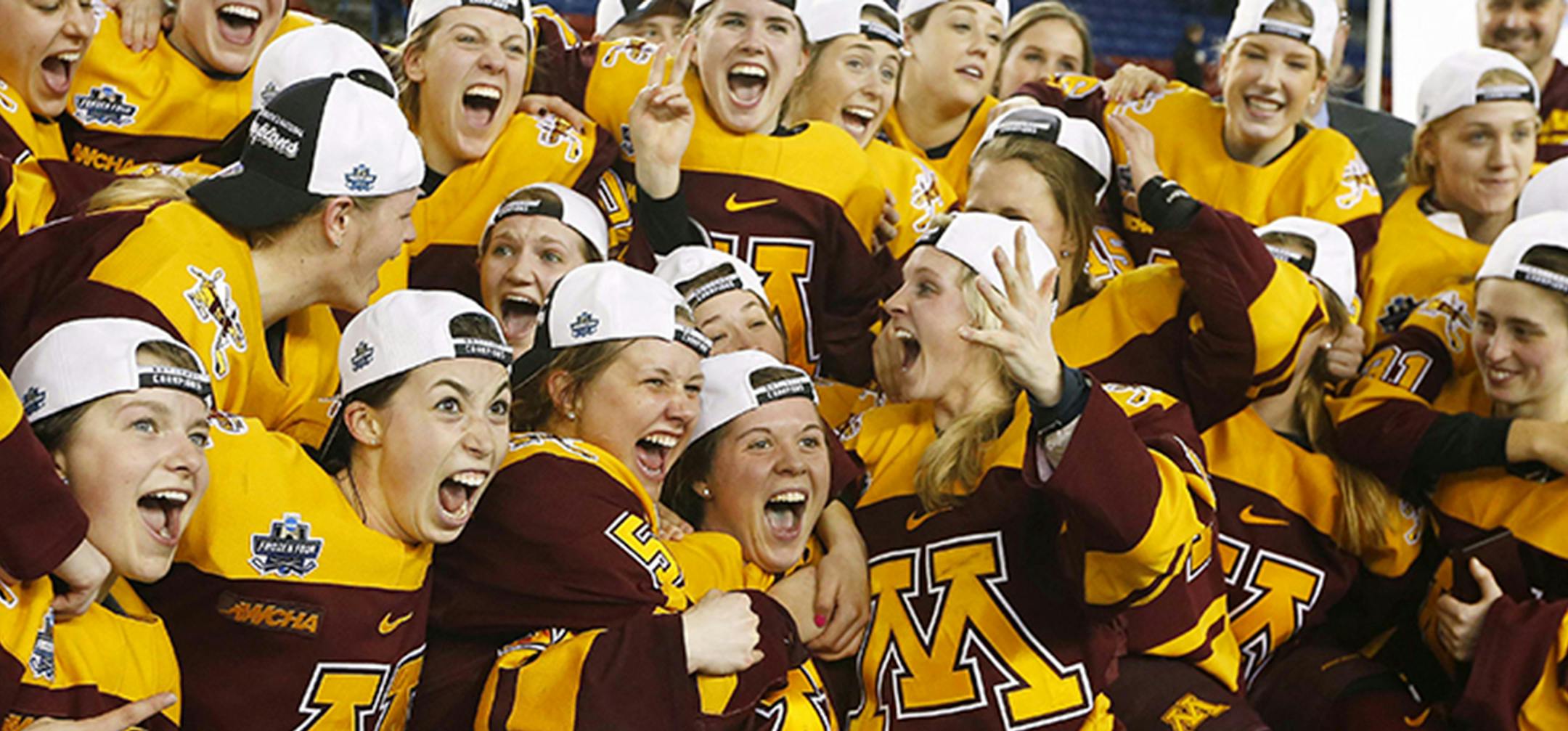 Minnesota players celebrate with the trophy after defeating Boston College 3-1 in the women's Frozen Four championship college hockey game in Durham, N.H. Sunday, March 20, 2016. (AP Photo/Winslow Townson) ORG XMIT: MIN2016032016300052 ORG XMIT: MIN1603201848200877