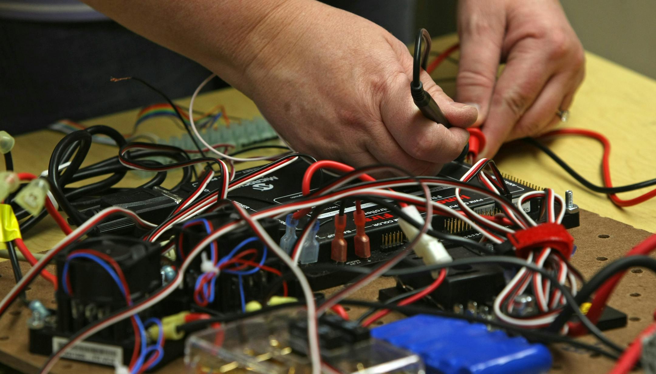Patrick Henry teacher Jill Johnson tested circuits as she worked on the school's robot entry for the First Robotics competition.