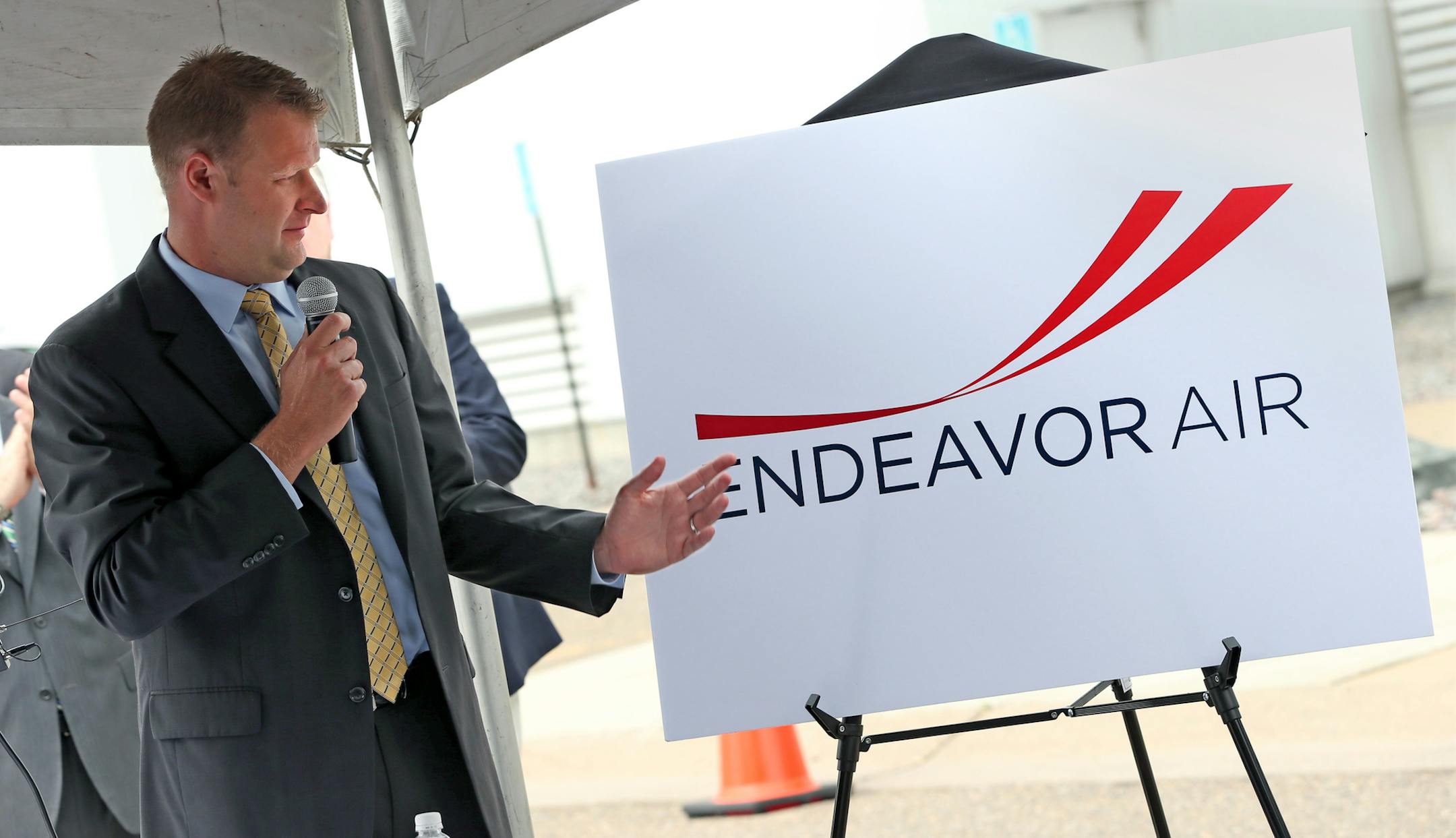 Ryan Gumm, President & CEO of Endeavor Air showed off the new company logo, during the ribbon cutting ceremonies at the Endeavor Air headquarters, formerly Pinnacle Airlines, at the Minneapolis St. Paul Airport on 6/26/13.] Bruce Bisping/Star Tribune bbisping@startribune.com