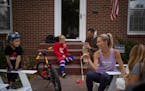 Carrie Tollefson had her nails painted by her daughter, Ruby, 11, while her youngest, Greer, 5, got ready to climb on the patio furniture and Everett,