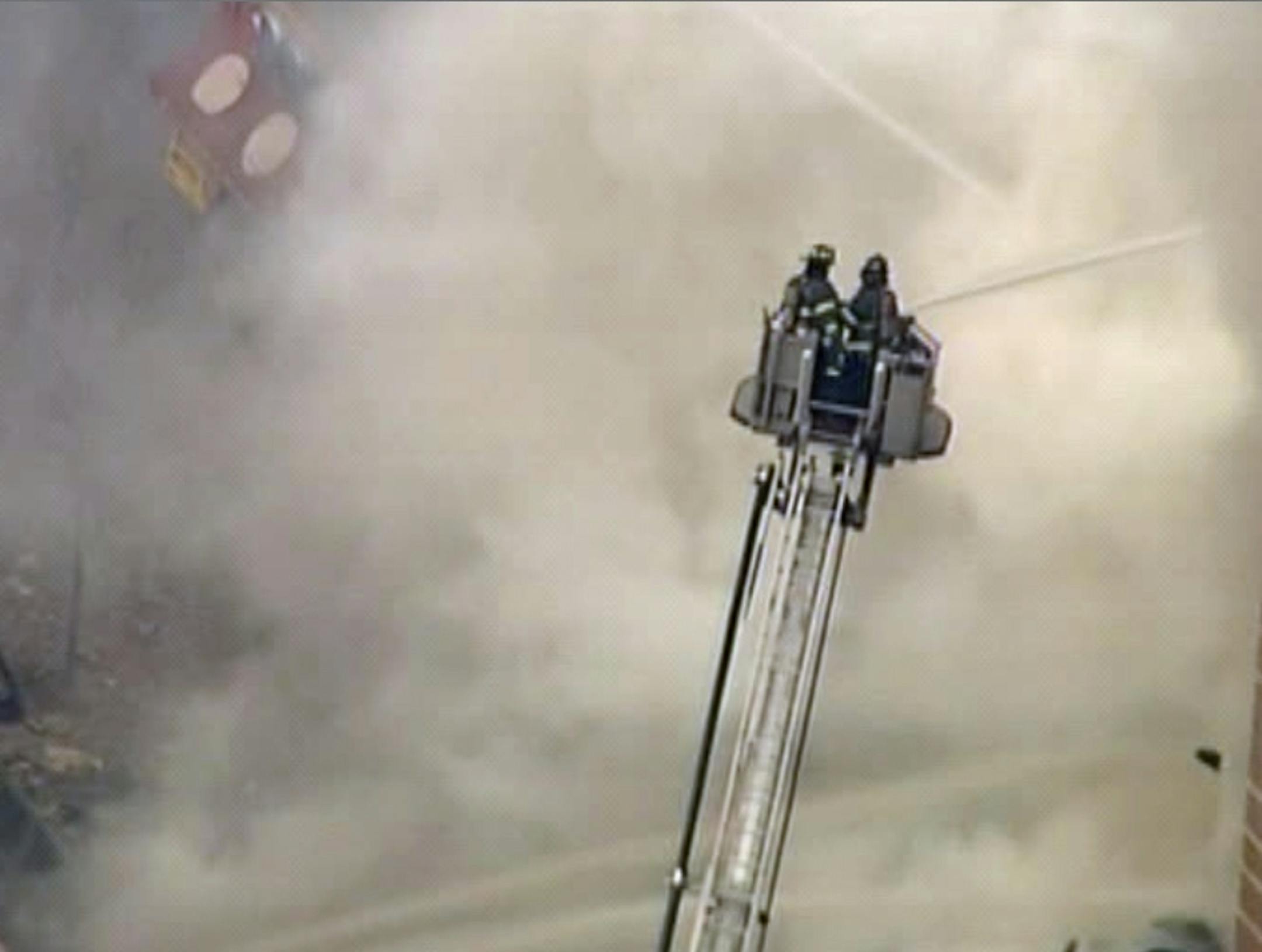 In this image taken from video from WABC, firefighters battle a blaze at the site of a possible explosion and building collapse in the East Harlem neighborhood of New York, Wednesday, March 12, 2014.