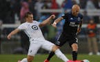 San Jose Earthquakes' Magnus Eriksson (7) keeps the ball away from Minnesota United FC's Robin Lod, left, in the first half of a game March 7.