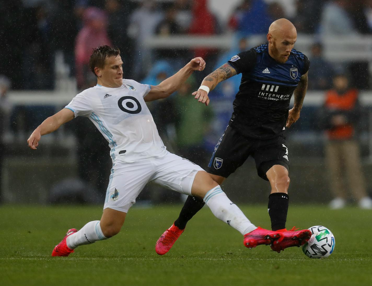 San Jose Earthquakes' Magnus Eriksson (7) keeps the ball away from Minnesota United FC's Robin Lod, left, in the first half of a game March 7.