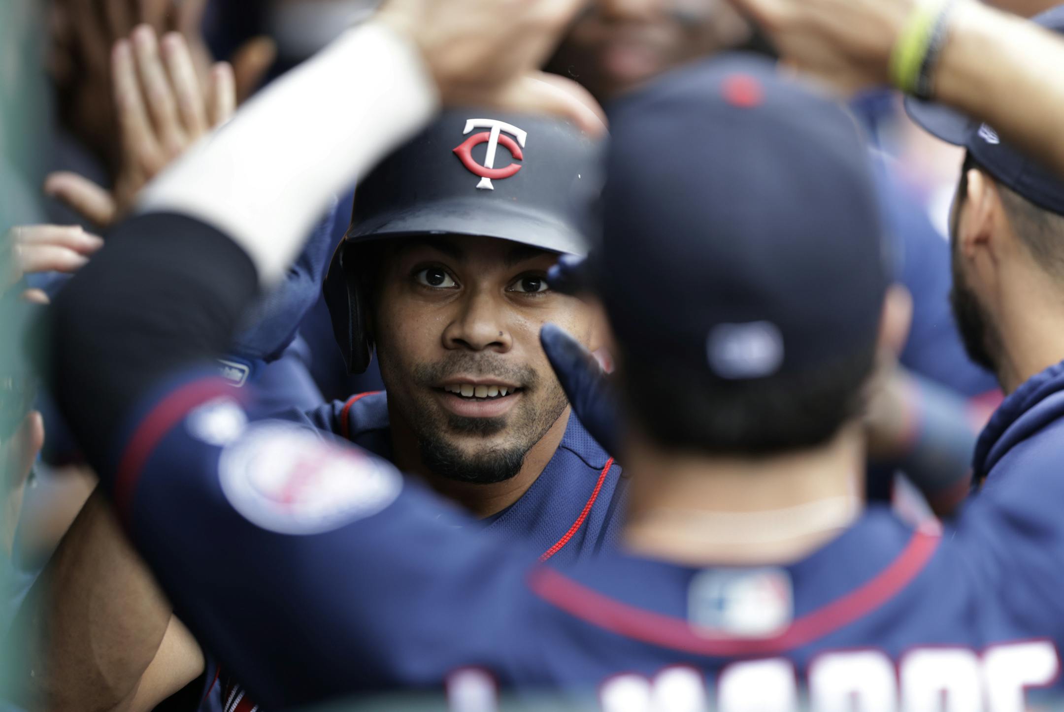 Minnesotta Twins' LaMonte Wade Jr. is congratulated by teammates after hitting a two-run home run in the sixth inning in a baseball game against the Cleveland Indians, Sunday, Sept. 15, 2019, in Cleveland. (AP Photo/Tony Dejak)