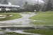 This Thursday June 23, 2016 image provided by the Greenbrier shows flooding on a fairway in front of the clubhouse of the Old White Course at the Gree
