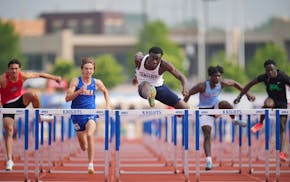 Rochester Century’s Josh Kyei-Baffour wins the boys 110m hurdles during the Class 3A MSHSL state track and field prelims at St. Michael-Albertville