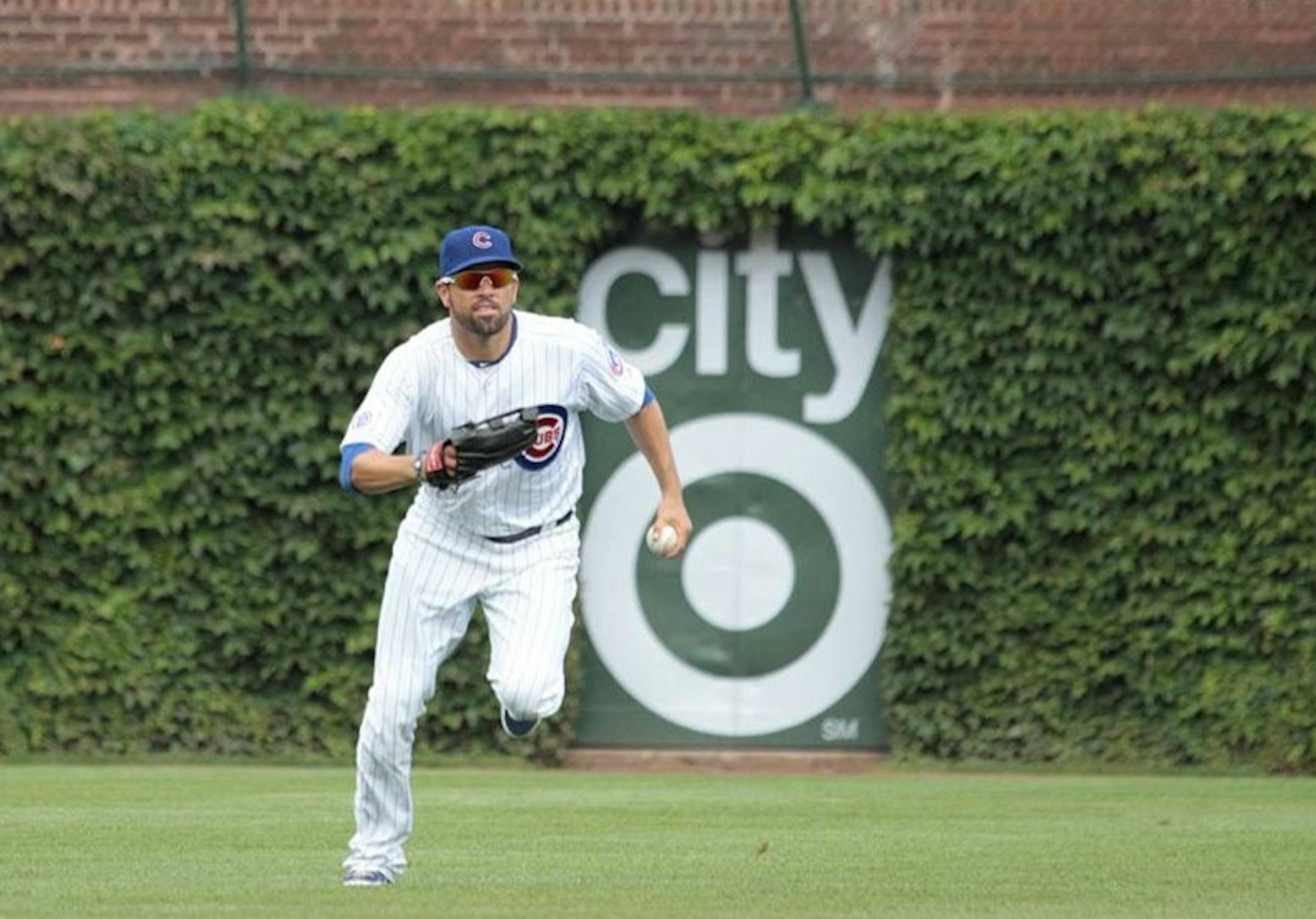 Target Corp. has placed its logo in perhaps the most valuable piece of real estate in Chicago, if not baseball: the ivy covered walls of Wrigley Field. The sponsorship deal with the Cubs is meant to plug its new CityTarget store in the city. Photo credit: Target ORG XMIT: MIN1307161422221103
