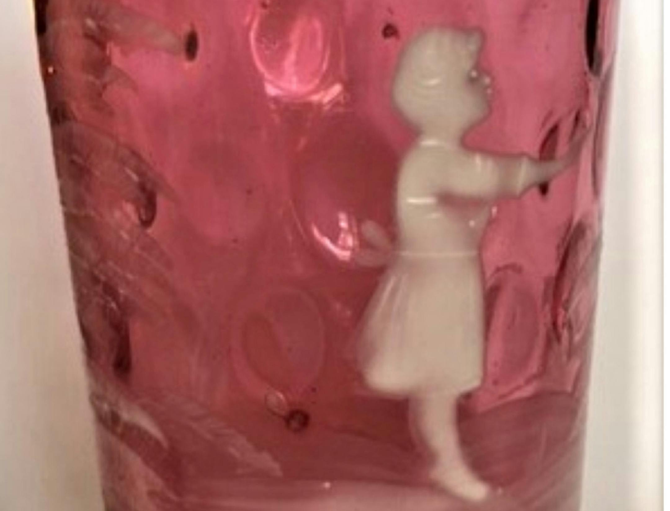 This is called a "Mary Gregory" tumbler.