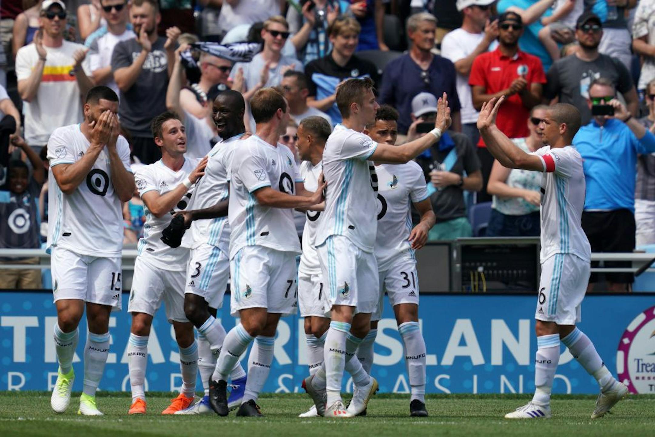 Minnesota United midfielder Osvaldo Alonso (6) congratulated Minnesota United midfielder Jan Gregus (8) after he scored the first goal of the match in the first half.