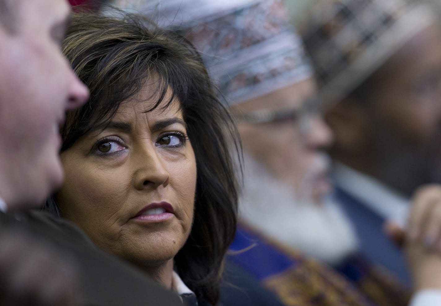 Minneapolis Police Chief Janee Harteau, sits in the audience during the White House Summit on Countering Violent Extremism, Wednesday, Feb. 18, 2015, in the South Court Auditorium of the Eisenhower Executive Office Building on the White House Complex in Washington. (AP Photo/Carolyn Kaster)