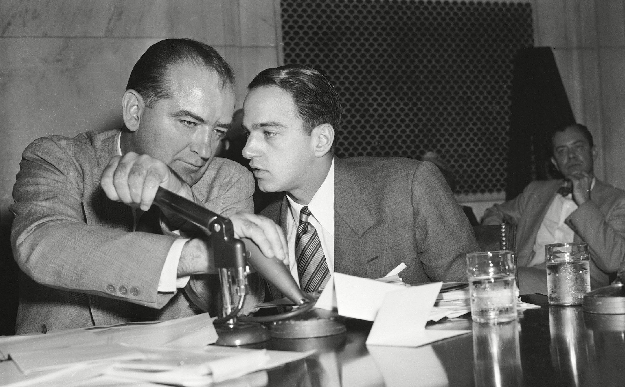 Mandatory Credit: Photo by AP/REX/Shutterstock (6648726a)
Senator Joseph McCarthy covers the microphones with his hands while having a whispered discussion with his chief counsel Roy Cohn during a committee hearing, in Washington. The entire event of the Senate subcommittee hearings on the Army-McCarthy charges is broadcasted live on television and radio
SENATOR MCCARTHY, WASHINGTON, USA ORG XMIT: 6648726a