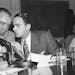 Mandatory Credit: Photo by AP/REX/Shutterstock (6648726a)
Senator Joseph McCarthy covers the microphones with his hands while having a whispered discu