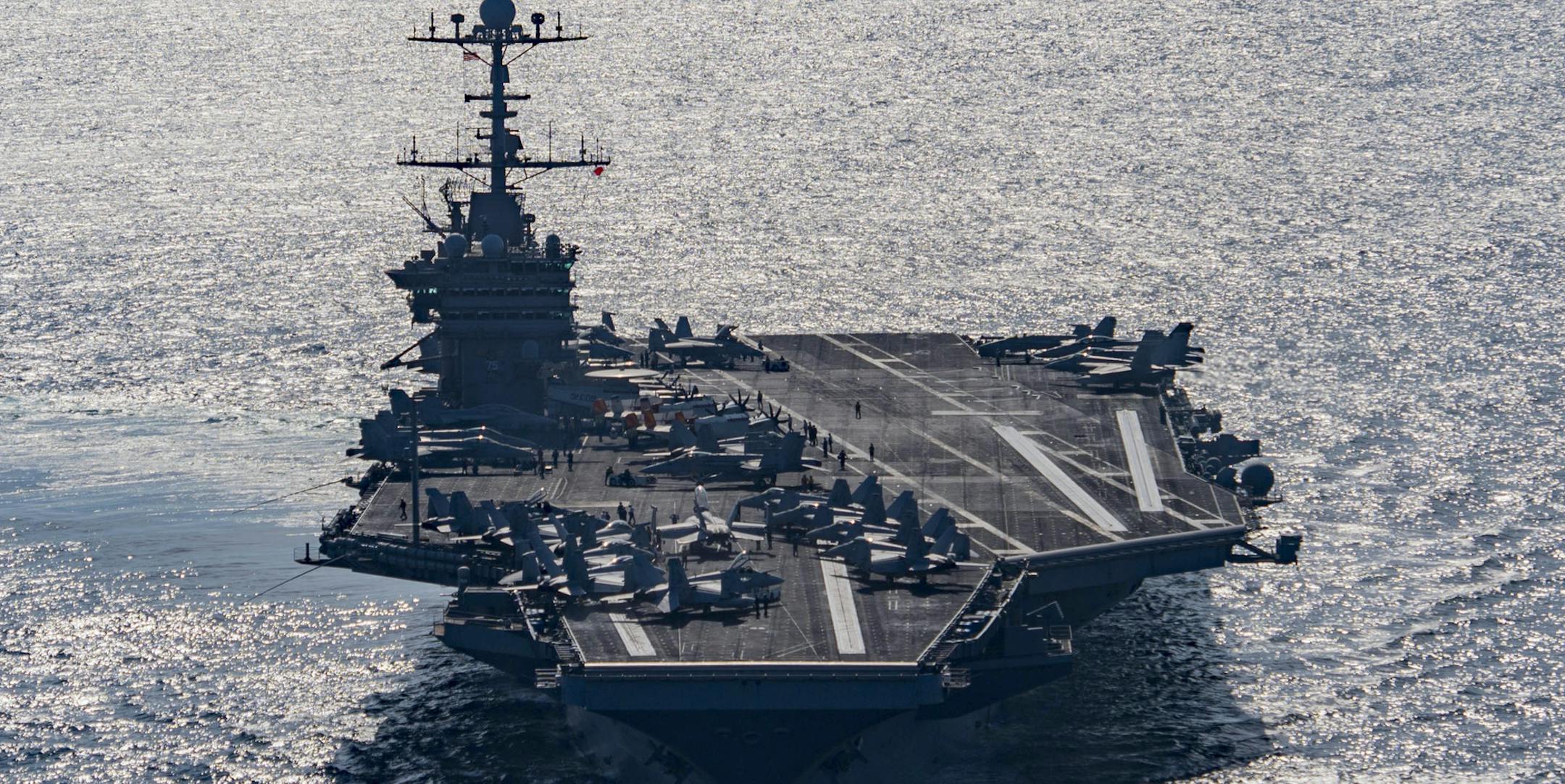 In this Friday, Dec. 25, 2015 photo released by the U.S. Navy, the aircraft carrier USS Harry S. Truman navigates the Gulf of Oman. Iranian naval vessels conducted rocket tests last week near the USS Harry S. Truman aircraft carrier, the USS Bulkeley destroyer and a French frigate, the FS Provence, and commercial traffic passing through the Strait of Hormuz, the American military said Wednesday, Dec. 30, 2015 causing new tension between the two nations after a landmark nuclear deal. (Mass Commun
