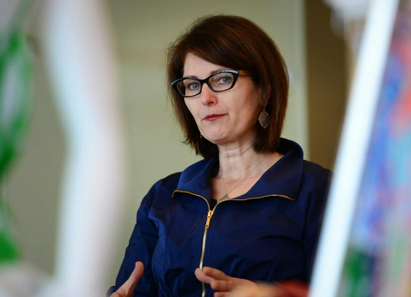 In this April 10, 2015 photo Kathee Tesija, Target's chief merchandising officer shows off some of Target's new Lilly Pulitzer collection, in Minneapolis. Target said in a Thursday, June 25, 2015 regulatory filing that Tesija, who also serves as executive vice president, will move temporarily to a strategic adviser role on July 6. She plans to leave the company in April 2016. (Glen Stubbe/Star Tribune via AP) MANDATORY CREDIT; ST. PAUL PIONEER PRESS OUT; MAGS OUT; TWIN CITIES LOCAL TELEVISION OU