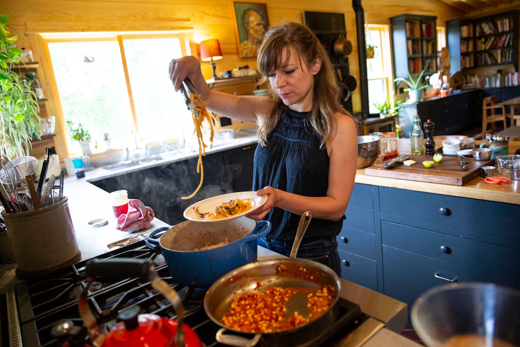 Amy Thielen prepares a pasta dish in her Park Rapids kitchen in this 2019 photo. Her latest book, 