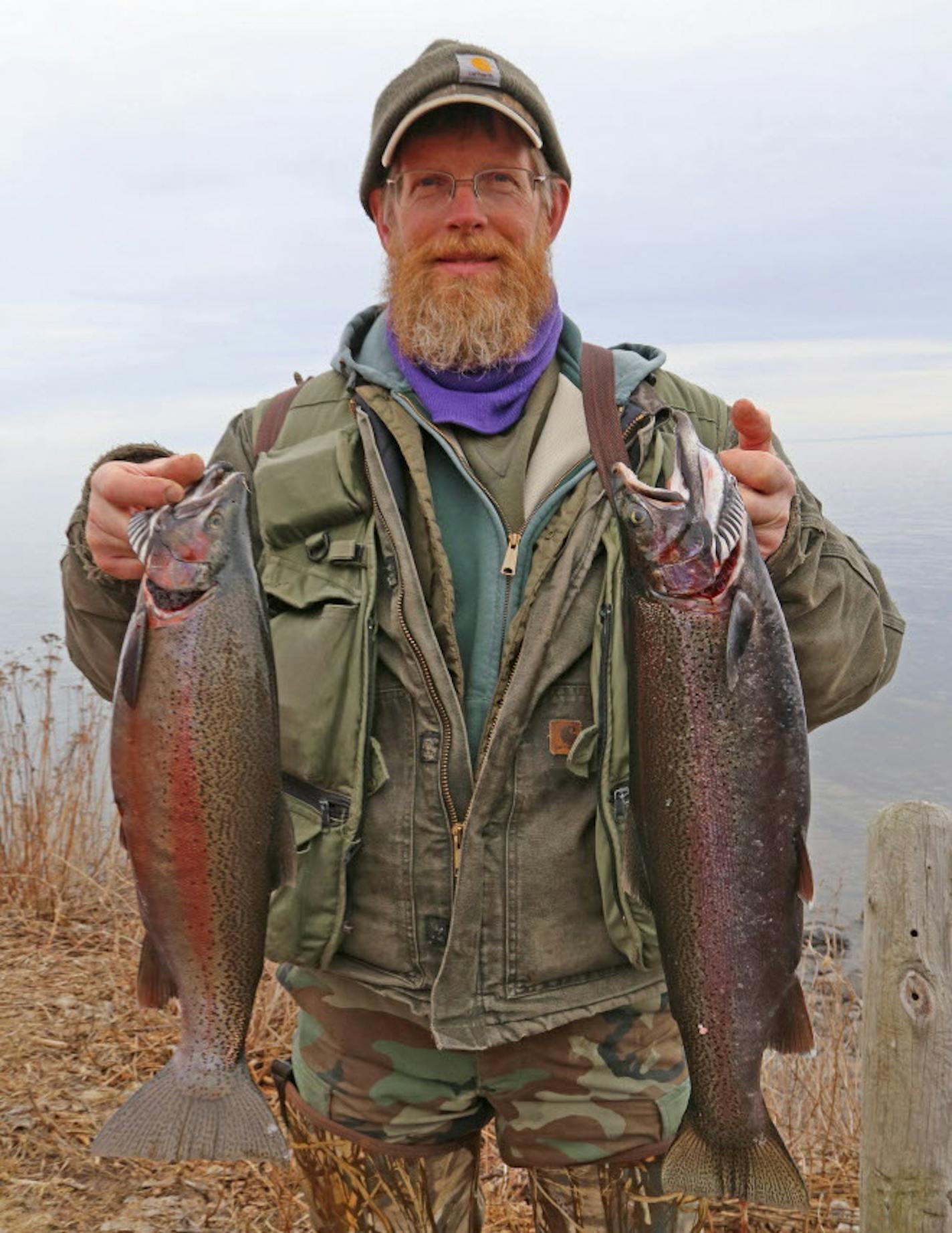 Forrest Overby of Duluth with two Kamloops, whose identities are known because one or more of their fins were clipped when they were stocked in Lake Superior.