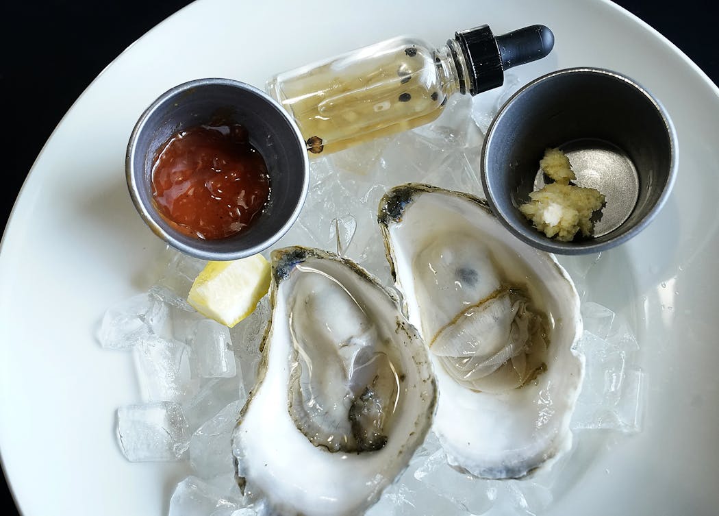The oysters — with mignonette, lemon, cocktail sauce and horseradish — are popular at Krewe in St. Joseph, Minn.