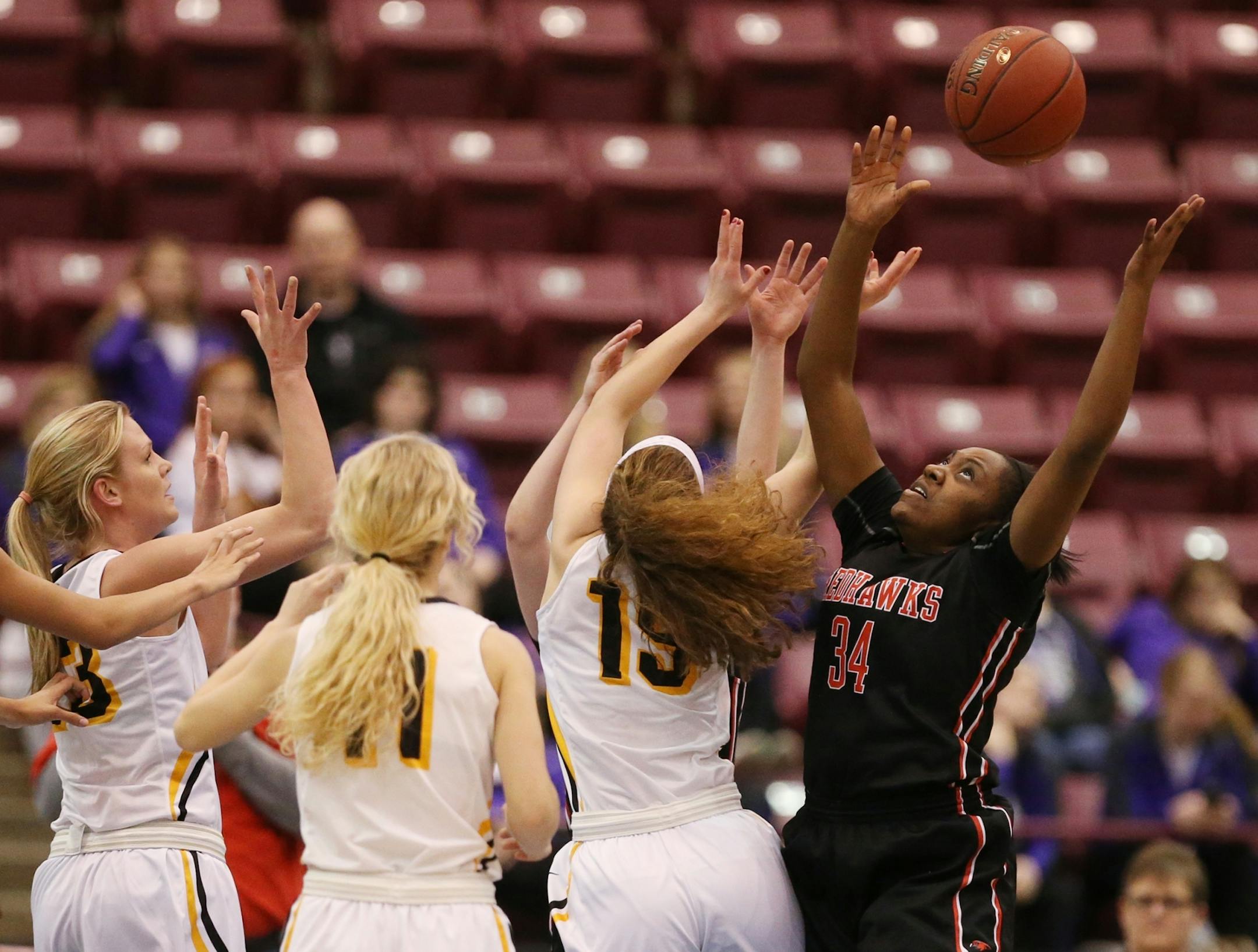 Kae Seana Barth-Lofton of Minnehaha Academy gets a rebound in the first half.