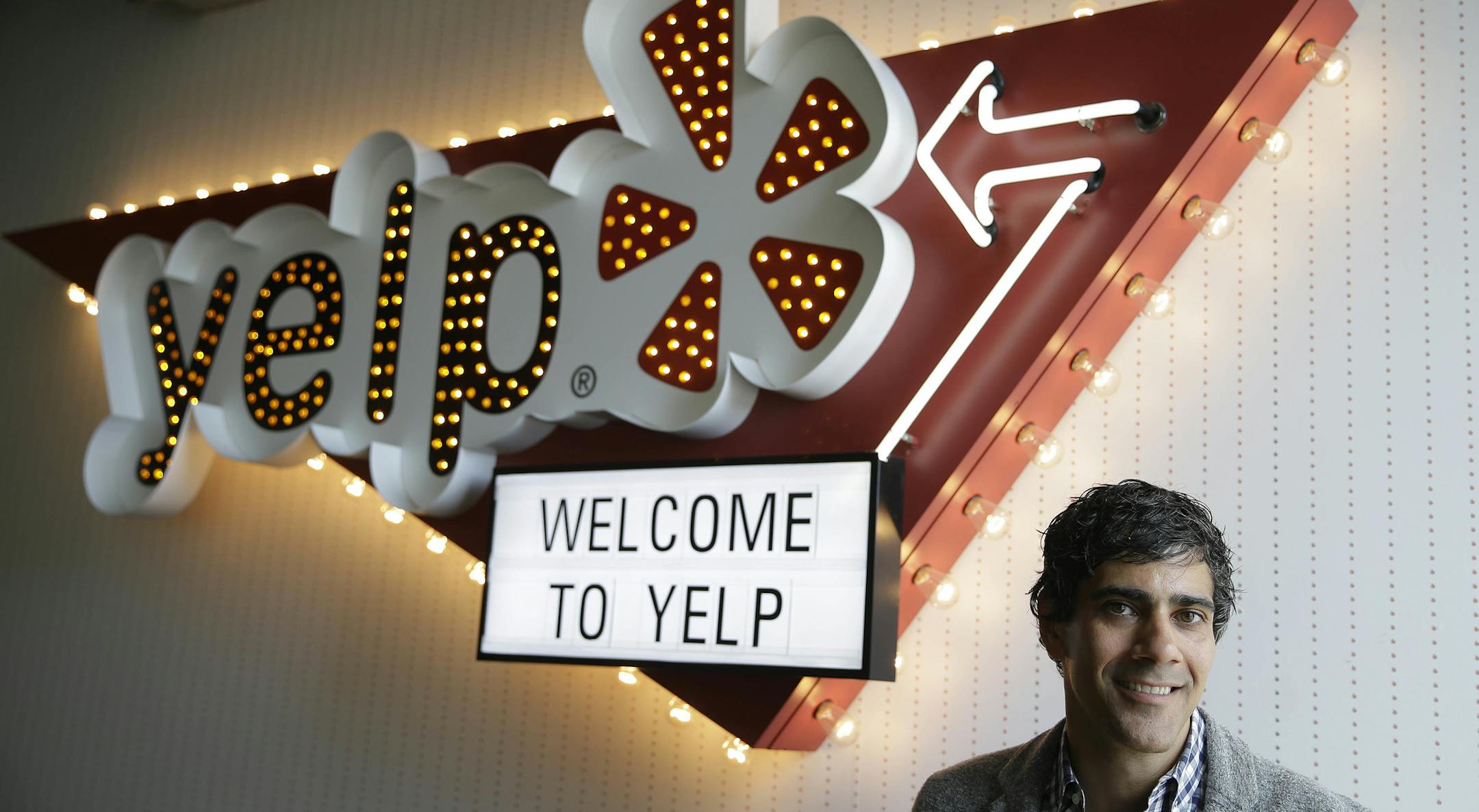 In this photo taken Friday, Aug. 1, 2014, Yelp CEO Jeremy Stoppelman poses at his company's headquarters in San Francisco. Stoppelman, 36, probably wouldn’t be running Yelp Inc. if he had paid more attention to the opinions of outsiders than his own insights. (AP Photo/Eric Risberg)