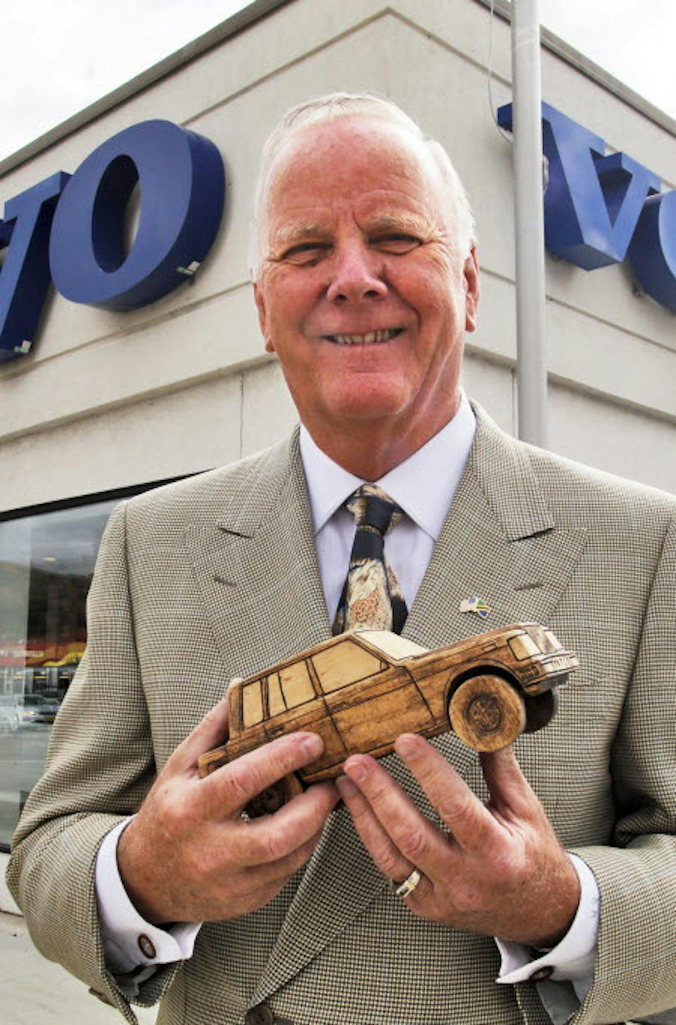 Borton Volvo chairman Kjell Bergh holding a wooden model of a 1982 Volvo 740 stands in front of his south Minneapolis dealership. ] Borton Volvo is moving from its south Minneapolis location to new headquarters in Golden Valley. (MARLIN LEVISON/STARTRIBUNE(mlevison@startribune.com)