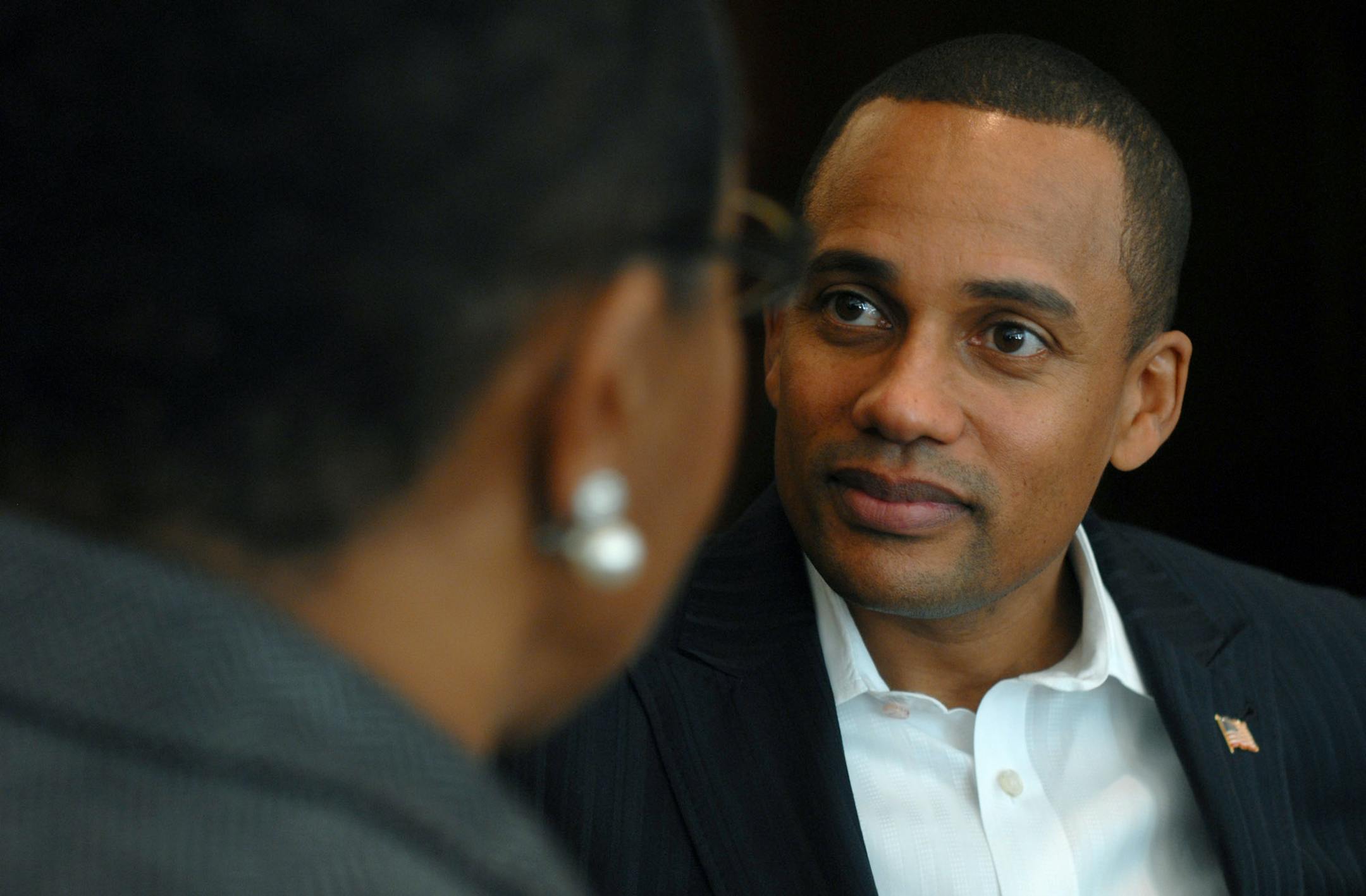 Actor Hill Harper, right, chats with CEO Gloria C. Lewis at the Big Brothers Big Sisters gala on Friday at the Metropolitan Ballroom in Golden Valley, Minn.
